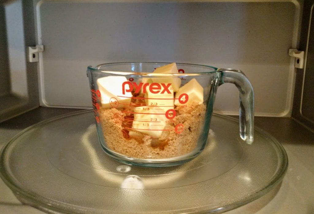 pyrex dish with brown sugar, butter and corn syrup in it