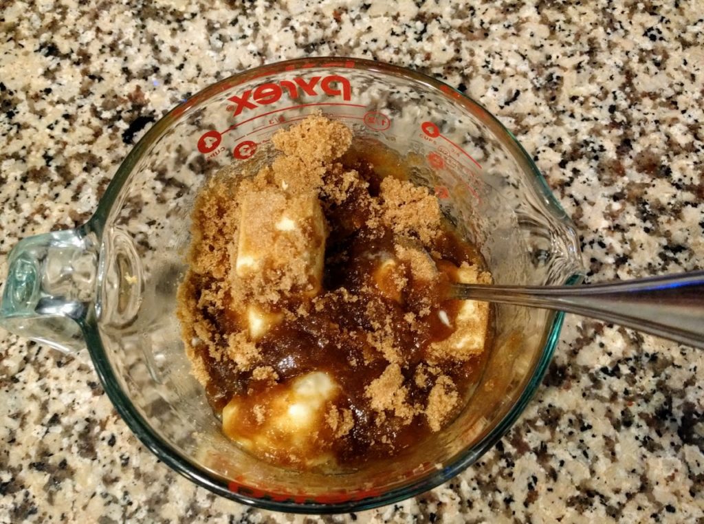 pyrex dish with brown sugar, butter and corn syrup in it