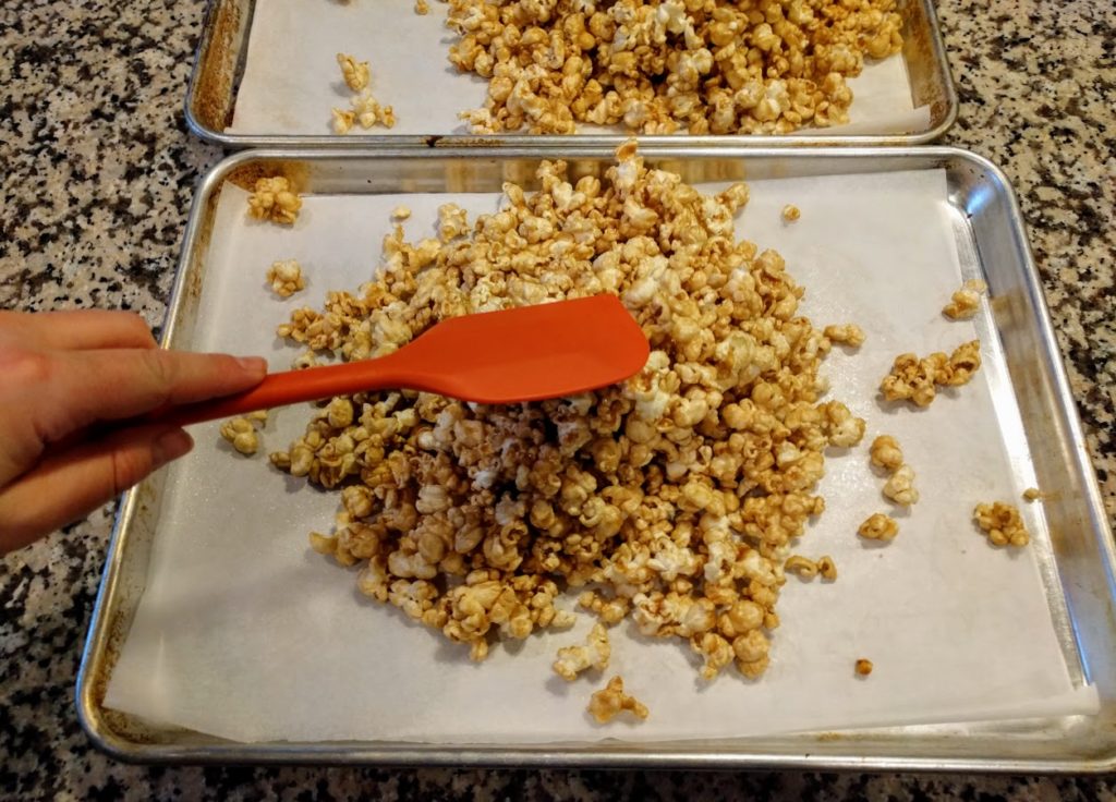 two baking trays of salted caramel popcorn