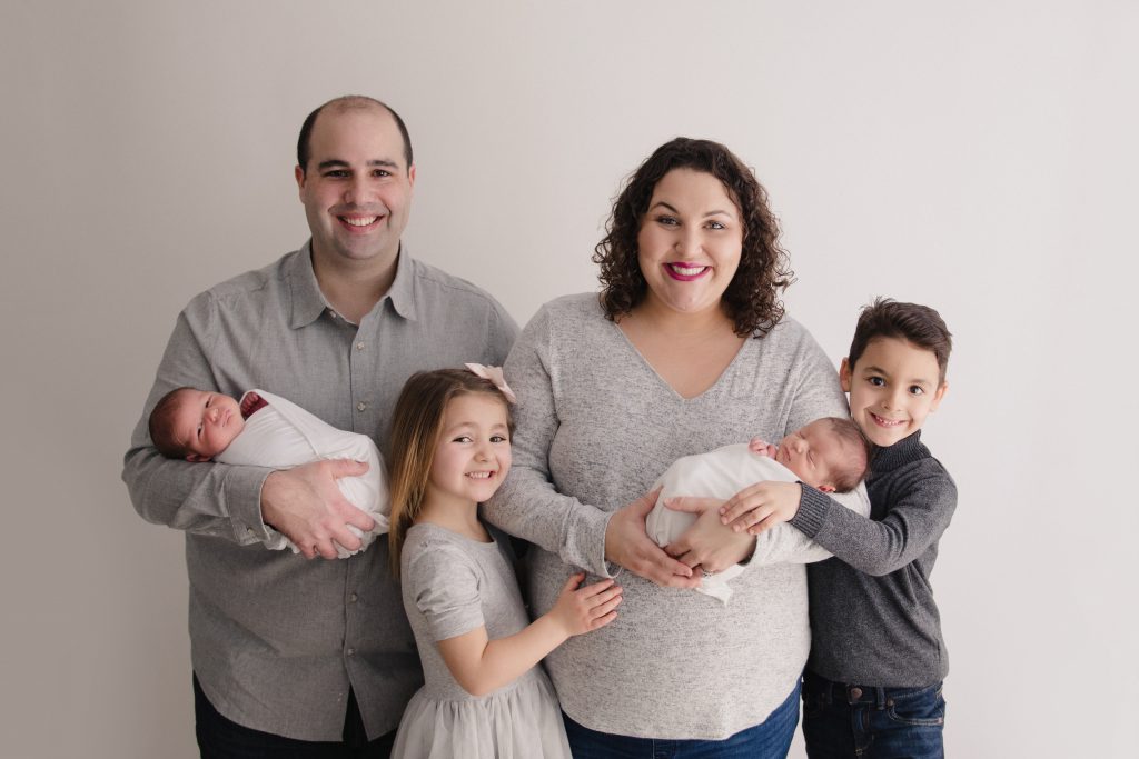 picture of a family of six people, a mother father and 4 children