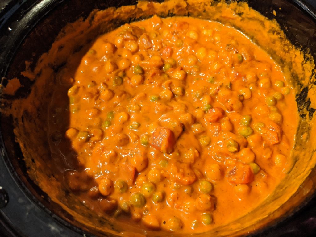 slow cooker filled with cooked chickpea coconut curry