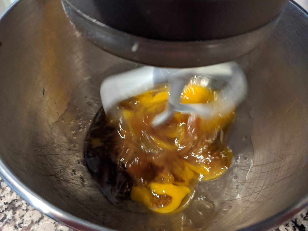 mixing bowl mixing eggs and oil