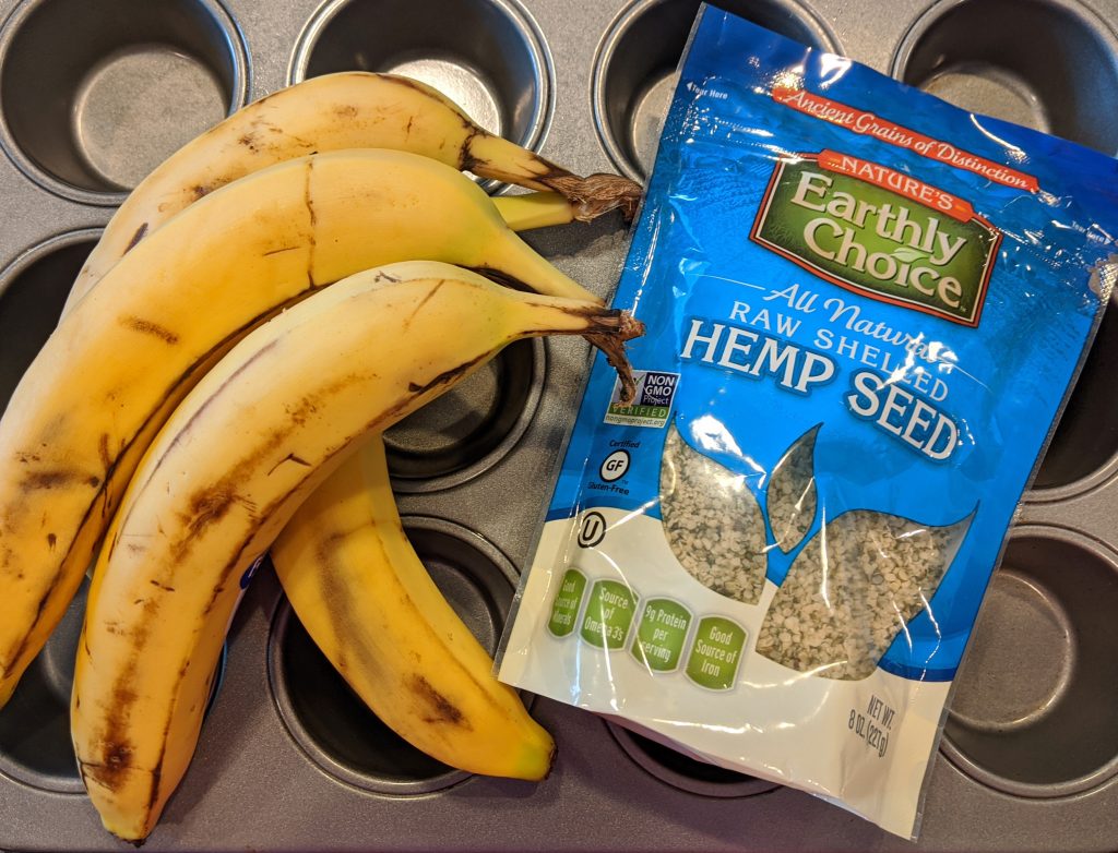 empty muffin tin with bananas and a bag of hemp hearts