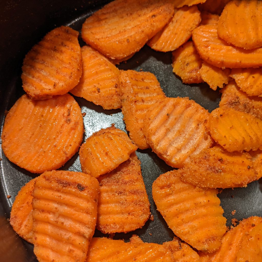 close up picture of uncooked carrot chips covered in fiesta ranch seasoning