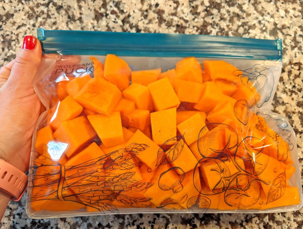 reusable silicone bag filled with cut butternut squash